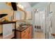 Charming bathroom with a unique seashell mirror and beach-themed decor creating a coastal ambiance at 766 Bayshore Dr, Terra Ceia, FL 34250