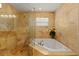 This bathroom features a separate glass shower and a bathtub for ultimate relaxation at 766 Bayshore Dr, Terra Ceia, FL 34250