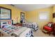 This comfortable bedroom is brightly painted and features twin beds with themed spreads at 766 Bayshore Dr, Terra Ceia, FL 34250