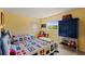 Comfortable bedroom featuring twin beds with nautical-themed bedding and bright, cheerful decor at 766 Bayshore Dr, Terra Ceia, FL 34250