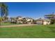 Beautiful exterior of a waterfront home with lush landscaping, brick driveway, and an attached garage at 766 Bayshore Dr, Terra Ceia, FL 34250