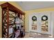 Bright hallway featuring a bookshelf and French doors leading to an outside deck with views of the water at 766 Bayshore Dr, Terra Ceia, FL 34250