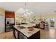Spacious kitchen with granite countertops, stainless steel appliances, and a central island at 766 Bayshore Dr, Terra Ceia, FL 34250