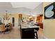 Expansive kitchen featuring a large island, stainless steel appliances, and dining area at 766 Bayshore Dr, Terra Ceia, FL 34250