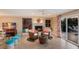 Comfortable living room featuring a fireplace and view of the backyard pool at 766 Bayshore Dr, Terra Ceia, FL 34250