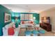 Comfortable living room featuring bright walls, modern furniture, ceiling fan, and a large TV at 766 Bayshore Dr, Terra Ceia, FL 34250