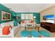 Stylish living room with turquoise walls, white sofas, and coastal accents creating a relaxing atmosphere at 766 Bayshore Dr, Terra Ceia, FL 34250