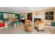 Spacious living room with a fireplace, comfortable seating, and stylish decor for relaxing and entertaining at 766 Bayshore Dr, Terra Ceia, FL 34250