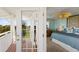 Bedroom featuring a bed with ensuite balcony access at 766 Bayshore Dr, Terra Ceia, FL 34250