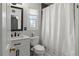 Bathroom featuring a vanity, mirror, toilet, and shower with curtain at 7735 Westmoreland Dr, Sarasota, FL 34243