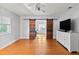 Bedroom with barn door and a ceiling fan at 7735 Westmoreland Dr, Sarasota, FL 34243