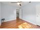 Bedroom featuring hardwood floors, ceiling fan, and neutral paint at 7735 Westmoreland Dr, Sarasota, FL 34243