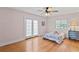 Bright bedroom features hardwood floors, natural light, and a closet for comfort and convenience at 7735 Westmoreland Dr, Sarasota, FL 34243