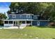 The renovated two-story home boasts a beautiful backyard, screened-in porch, and refreshing pool at 7735 Westmoreland Dr, Sarasota, FL 34243