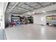 Spacious garage with epoxy flooring, shelving, and ample storage space at 7735 Westmoreland Dr, Sarasota, FL 34243