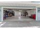 A spacious garage is with ample storage, epoxy flooring, and an organized layout at 7735 Westmoreland Dr, Sarasota, FL 34243