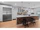 Modern kitchen with a large island, stainless steel Viking refrigerator, brick accents and stool seating at 7735 Westmoreland Dr, Sarasota, FL 34243