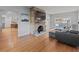Bright living room with hardwood floors, brick fireplace, and modern furniture at 7735 Westmoreland Dr, Sarasota, FL 34243