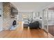 Comfortable living room featuring a brick fireplace and modern decor at 7735 Westmoreland Dr, Sarasota, FL 34243