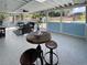The enclosed porch offers a comfortable seating area and scenic views of the lush backyard and sparkling pool at 7735 Westmoreland Dr, Sarasota, FL 34243