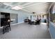 A spacious sunroom is furnished with comfortable seating, perfect for relaxing and enjoying natural light at 7735 Westmoreland Dr, Sarasota, FL 34243