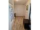 Bright bathroom with open floor plan, featuring wood look tile floors and modern bathroom accessories at 775 36Th S Ave, St Petersburg, FL 33705