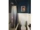 Full bathroom with a shower and tub combination and unique dark blue walls and white trim at 775 36Th S Ave, St Petersburg, FL 33705