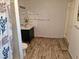 Bathroom featuring a floating vanity with a vessel sink and a wood-look tile floor at 775 36Th S Ave, St Petersburg, FL 33705