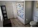 Bright bathroom with white bathtub, wood look tile floor, and modern accessories, creating a clean and inviting space at 775 36Th S Ave, St Petersburg, FL 33705