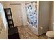 Bright bathroom with white bathtub, wood look tile floor, and modern accessories, creating a clean and inviting space at 775 36Th S Ave, St Petersburg, FL 33705