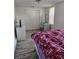 Bedroom featuring an exterior view, closet space, and wooden-look tile flooring at 775 36Th S Ave, St Petersburg, FL 33705