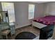 Cozy bedroom with two windows, a vanity, and wood-look tile floor at 775 36Th S Ave, St Petersburg, FL 33705