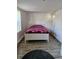 Bedroom with natural light, wood-look tile floor, and white painted walls and door at 775 36Th S Ave, St Petersburg, FL 33705