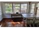 Bright dining room featuring hardwood floors, modern table, and desk with storage at 775 36Th S Ave, St Petersburg, FL 33705