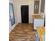 Eat-in kitchen with wood look floors, black refrigerator, and wood counters at 775 36Th S Ave, St Petersburg, FL 33705
