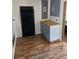 Bright kitchen has new flooring, butcher block countertops and modern grey cabinets at 775 36Th S Ave, St Petersburg, FL 33705