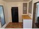 Eat-in kitchen with wood look floors, black refrigerator, and wood counters at 775 36Th S Ave, St Petersburg, FL 33705
