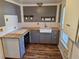 Well-lit kitchen featuring light wood countertops, grey cabinetry, and tiled backsplash at 775 36Th S Ave, St Petersburg, FL 33705