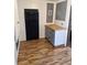 Bright kitchen has new flooring, butcher block countertops and modern grey cabinets at 775 36Th S Ave, St Petersburg, FL 33705