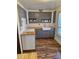 Cozy kitchen features white tile backsplash, butcher block counters, and hardwood floors at 775 36Th S Ave, St Petersburg, FL 33705