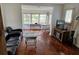 Cozy living room with hardwood floors, modern furniture, and view into the dining room at 775 36Th S Ave, St Petersburg, FL 33705