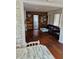 Cozy living room with wood accent wall, charming decor, and hardwood floors at 775 36Th S Ave, St Petersburg, FL 33705