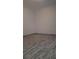 A spacious room with light-colored wood-look tile floors and neutral walls at 775 36Th S Ave, St Petersburg, FL 33705