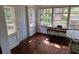 Bright sun room with lots of natural light, hardwood floors, and a view of the outdoors at 775 36Th S Ave, St Petersburg, FL 33705