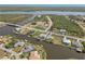 Stunning aerial shot of canal-front homes, illustrating the community's waterfront lifestyle at 9317 Saint Paul Drive, Port Charlotte, FL 33981