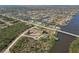 Sprawling aerial view of a waterfront community featuring canals, homes, and lush greenery at 9317 Saint Paul Drive, Port Charlotte, FL 33981