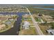 Panoramic aerial view of waterfront properties with convenient road access in a prime location at 9317 Saint Paul Drive, Port Charlotte, FL 33981