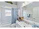 Bright bathroom featuring a vanity, shower-tub combo and decor at 9317 Saint Paul Drive, Port Charlotte, FL 33981