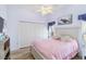 Cozy bedroom with a ceiling fan, ample closet space, and soft, inviting decor at 9317 Saint Paul Drive, Port Charlotte, FL 33981
