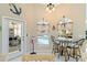Breakfast nook area with pool views and access to the outside at 9317 Saint Paul Drive, Port Charlotte, FL 33981